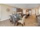 Eat-in kitchen featuring stainless steel appliances, tile backsplash, and a glass table at 3002 Paddington Dr, Indian Trail, NC 28079