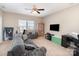 Spacious living room with a ceiling fan, comfortable seating, and media center at 3002 Paddington Dr, Indian Trail, NC 28079