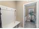 Mud room with coat hooks leads into a laundry area with modern appliances at 3002 Paddington Dr, Indian Trail, NC 28079