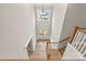 Inviting foyer with hardwood floors, staircase and a large window above the front door at 3034 Tramore Dr, Harrisburg, NC 28075