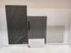 This photo showcases dark grey color palette, featuring tile, countertop, and cabinet samples at 3034 Tramore Dr, Harrisburg, NC 28075