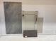 An image showcasing material selections featuring a beige cabinet, quartz countertop, and marble-look tile at 3034 Tramore Dr, Harrisburg, NC 28075