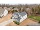 Aerial view of a well-maintained home featuring a gray roof, a spacious backyard, and beautiful landscaping at 3549 Sandy E Trl, Fort Mill, SC 29707
