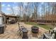Backyard featuring a stone patio with gazebo, fire pit, and trampoline, ideal for outdoor activities at 3549 Sandy E Trl, Fort Mill, SC 29707