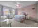 Bright bedroom with carpet, pastel walls, a unicorn theme, and ample natural light at 3549 Sandy E Trl, Fort Mill, SC 29707