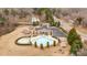 Overhead view of community pool and recreational facilities including playground, gazebo, hot tub, and parking at 3549 Sandy E Trl, Fort Mill, SC 29707