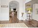Inviting entryway with wood floors and arched doorways, offering a glimpse into the home's layout at 3549 Sandy E Trl, Fort Mill, SC 29707