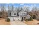 Charming two-story home boasts a two-car garage, neutral paint and manicured landscaping at 3549 Sandy E Trl, Fort Mill, SC 29707