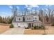 Beautiful two story home with a three-car garage, manicured lawn, stone accents, and a welcoming front porch at 3549 Sandy E Trl, Fort Mill, SC 29707