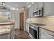 Well-lit kitchen features granite countertops and stainless steel oven and microwave at 3549 Sandy E Trl, Fort Mill, SC 29707