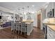 Spacious kitchen featuring an island, wooden countertops, stainless steel appliances, and white cabinets at 3549 Sandy E Trl, Fort Mill, SC 29707