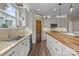 Modern kitchen featuring granite counters, stylish tile backsplash, and white cabinets at 3549 Sandy E Trl, Fort Mill, SC 29707