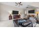 Open-concept living room with leather sectional, modern TV, and a comfortable layout at 3549 Sandy E Trl, Fort Mill, SC 29707