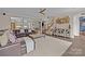 Open-concept living room featuring stylish decor, wood floors, and natural light at 3549 Sandy E Trl, Fort Mill, SC 29707