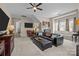 Large living room with a leather sectional, chess table, and plenty of seating near large windows at 3549 Sandy E Trl, Fort Mill, SC 29707