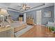 Main bedroom showcasing wood floors and ensuite bath entrance at 3549 Sandy E Trl, Fort Mill, SC 29707