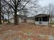 Backyard view showing home and the screened-in back porch at 3708 Secrest Shortcut Rd, Monroe, NC 28110