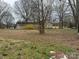 Expansive backyard showcasing the potential for outdoor enjoyment and recreation at 3708 Secrest Shortcut Rd, Monroe, NC 28110