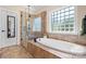 Elegant bathroom features a soaking tub and a separate glass-enclosed shower at 3815 10Th Ne St, Hickory, NC 28601