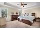 Spacious bedroom features tray ceilings, plush carpet, and a serene atmosphere at 3815 10Th Ne St, Hickory, NC 28601