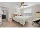 Comfortable bedroom featuring a connecting bathroom, window, and ceiling fan at 3815 10Th Ne St, Hickory, NC 28601