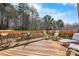 A spacious wooden deck is furnished with seating areas and decor, offering outdoor relaxation at 3815 10Th Ne St, Hickory, NC 28601