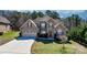 Stately brick home featuring a well-manicured front yard, arched windows and a three car garage at 3815 10Th Ne St, Hickory, NC 28601