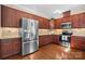 This kitchen boasts stainless steel appliances, generous cabinet space, and hardwood flooring at 3815 10Th Ne St, Hickory, NC 28601