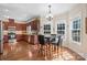 Eat-in kitchen featuring wood floors, stainless appliances and plenty of cabinet space at 3815 10Th Ne St, Hickory, NC 28601