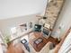 Open living room featuring a stone fireplace, hardwood floors, and large windows at 3815 10Th Ne St, Hickory, NC 28601
