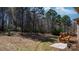 A spacious backyard with a combination of lawn, woods, and a wooden deck at 3815 10Th Ne St, Hickory, NC 28601