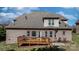 Spacious backyard view highlighting deck, lush lawn, and exterior of brick home at 3815 10Th Ne St, Hickory, NC 28601