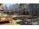 Overhead view of a spacious backyard with a wooden deck and distant play set at 3815 10Th Ne St, Hickory, NC 28601