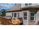 Charming brick home featuring an inviting wooden deck, perfect for outdoor relaxation and entertaining with a seating area at 3815 10Th Ne St, Hickory, NC 28601