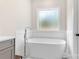 Modern bathroom features a standalone tub with elegant fixtures and natural light at 4808 1St Nw St, Hickory, NC 28601