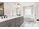 Elegant bathroom features double vanity, soaking tub, and stylish marble flooring at 4808 1St Nw St, Hickory, NC 28601