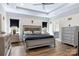 Spacious bedroom with tray ceiling, hardwood floors, and abundant natural light at 4808 1St Nw St, Hickory, NC 28601