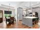 Charming dining area with modern chandelier, wooden table and lots of natural light at 4808 1St Nw St, Hickory, NC 28601