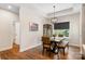 Well-lit dining room featuring modern chandelier, hardwood floors and lots of space at 4808 1St Nw St, Hickory, NC 28601