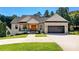 Beautiful white brick home with a two-car garage, a covered porch and manicured lawn at 4808 1St Nw St, Hickory, NC 28601