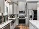 Contemporary kitchen featuring stainless steel appliances, gray cabinets, and an island with quartz countertops at 4808 1St Nw St, Hickory, NC 28601