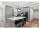 Modern kitchen with grey cabinetry, stainless steel appliances, and island with seating at 4808 1St Nw St, Hickory, NC 28601