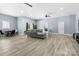 Open living room with hardwood floors, modern sofa, and lots of natural light at 4808 1St Nw St, Hickory, NC 28601