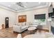 Comfortable living room boasts a fireplace, hardwood floors, crown molding and lots of natural light at 4808 1St Nw St, Hickory, NC 28601