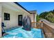 Outdoor patio with a vibrant area rug and a covered grill, perfect for entertaining at 4808 1St Nw St, Hickory, NC 28601