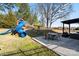 Large backyard featuring a playground, outdoor dining area, and a spacious lawn, ideal for Gathering activities at 5703 Eleanor Rigby Rd, Charlotte, NC 28278