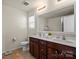 Charming bathroom with a double vanity, updated fixtures, and ample storage space, great for comfort at 5703 Eleanor Rigby Rd, Charlotte, NC 28278