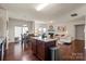 Open dining area and kitchen combination with stainless steel appliances and granite countertops at 5703 Eleanor Rigby Rd, Charlotte, NC 28278