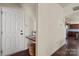 Inviting foyer with stylish flooring, featuring a convenient built-in desk and an adjacent view into the kitchen at 5703 Eleanor Rigby Rd, Charlotte, NC 28278