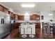 Charming kitchen featuring stainless steel appliances, granite countertops, and island with bar stool seating at 5703 Eleanor Rigby Rd, Charlotte, NC 28278